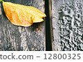 Wet leaf on a banch 12800325