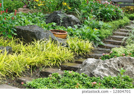 Natural stone stairs landscaping in home garden 12804701