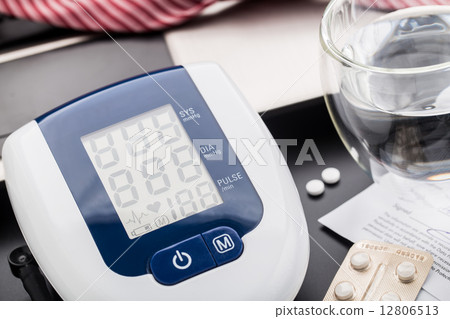 Checking blood pressure in office Checking blood pressure in office 12806513