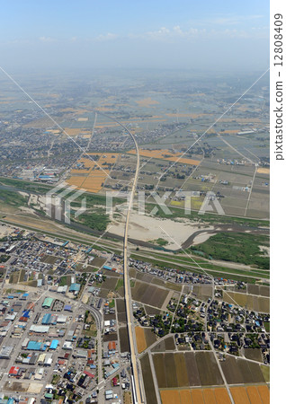 Aerial view of the Hokuriku Shinkansen under construction from the upper part of Imizu City 12808409