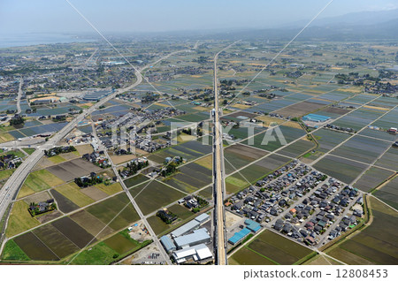 Aerial view of the Hokuriku Shinkansen under construction from over the Toyama city 12808453