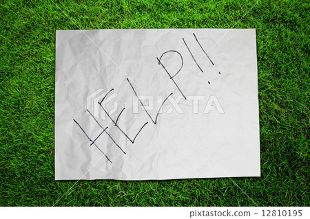 Paper Help on green grass field 12810195