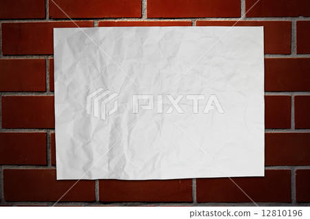 Paper on brickwall Paper on brickwall 12810196