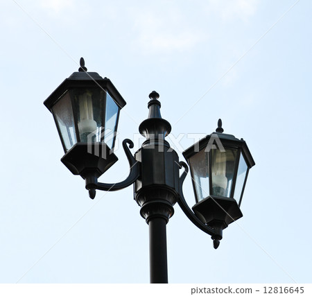 Old city lamp isolated on sky 12816645