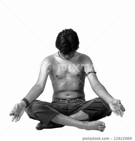 A young Indian modern man meditatin in lotus pose A young Indian modern man meditatin in lotus pose 12822069