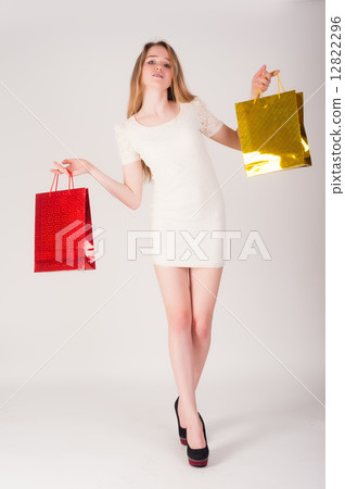 Funny blond woman with shopping bags 12822296