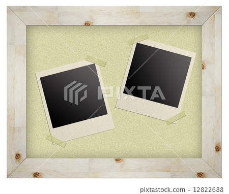 blank photo frames on cork board isolated 12822688