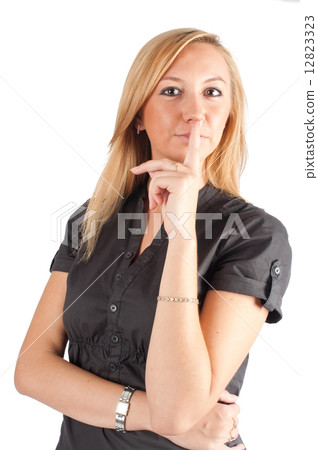 Woman gesturing to silence Woman gesturing to silence 12823323