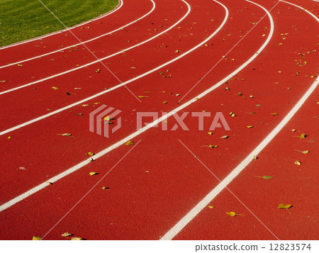 Red Running Track with white lines 12823574