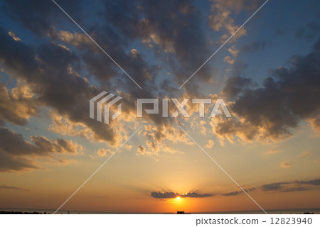 Sunset over sea 12823940