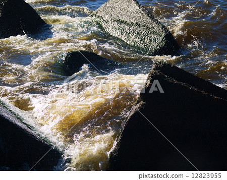 Clear sea water and the big stones 12823955
