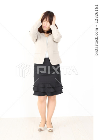 A woman holding a head A woman holding a head 12826161