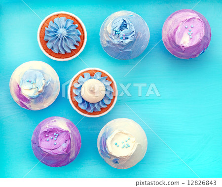 Sweet holiday buffet with vivid cupcakes  12826843