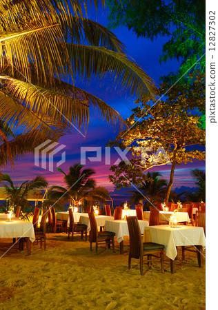 Outdoor restaurant at the beach during sunset, Phuket, Thailand 12827302