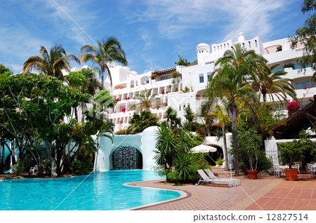 Swimming pool with waterfall and building of luxury hotel, Tener 12827514