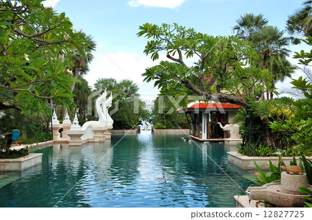 Swimming pool and bar in tradional Thai style at the luxury hote 12827725