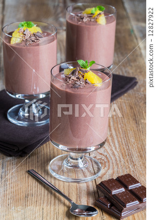 Chocolate pudding dessert with orange and grated chocolate 12827922