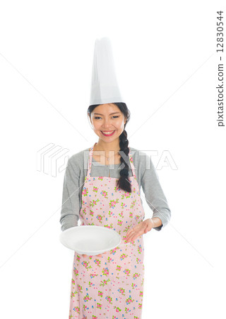 asian female chef holding a plate in casual asian female chef holding a plate in casual 12830544