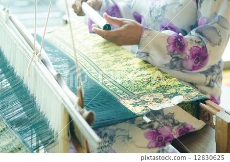 traditional batik cloth making by a woman in malaysia 12830625
