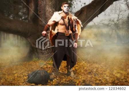 Portrait of a muscular ancient warrior with a sword Portrait of a muscular ancient warrior with a sword 12834602