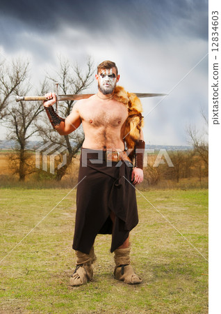 Portrait of a muscular ancient warrior with a sword Portrait of a muscular ancient warrior with a sword 12834603