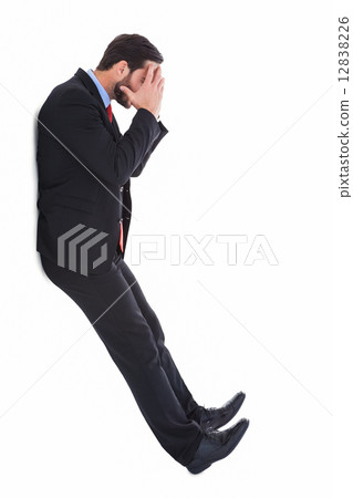 Worried businessman with head in hands Worried businessman with head in hands 12838226