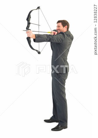 Businessman shooting a bow and arrow 12838227