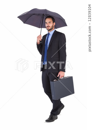 Businessman in suit holding umbrella and briefcase Businessman in suit holding umbrella and briefcase 12839104