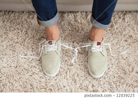 Casual mans shoelaces tied together Casual mans shoelaces tied together 12839225