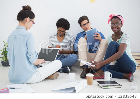 Young creative team brainstorming together 12839548