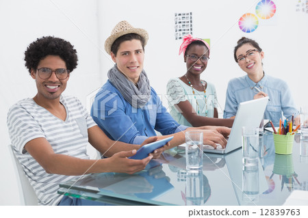 Young creative team having a meeting Young creative team having a meeting 12839763