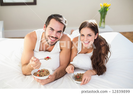 Young couple having breakfast in bed 12839899