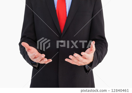 Businessman presenting with his hands Businessman presenting with his hands 12840461