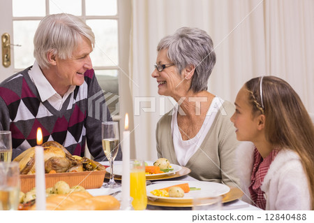 Portrait of grandparents and daughter at christmas 12840488