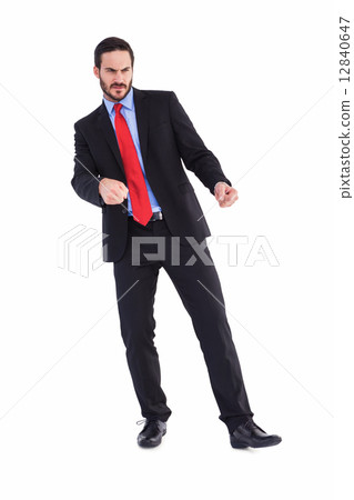 Handsome businessman pulling with hands Handsome businessman pulling with hands 12840647