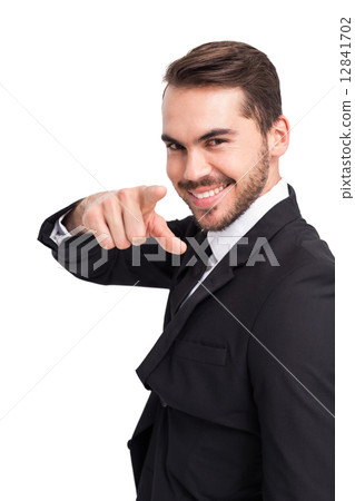 Happy businessman pointing his finger Happy businessman pointing his finger 12841702