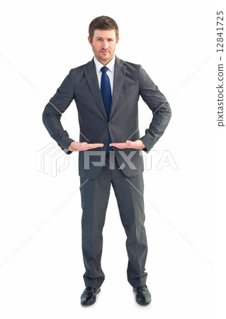 Businessman standing with hands out 12841725