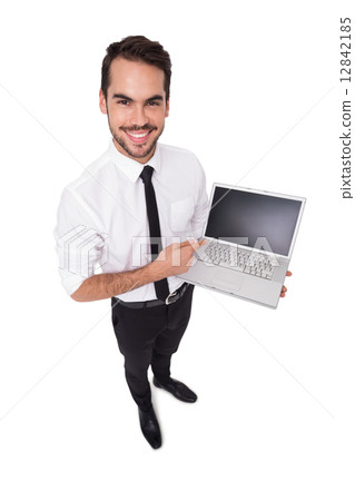 Smiling businessman pointing his laptop 12842185