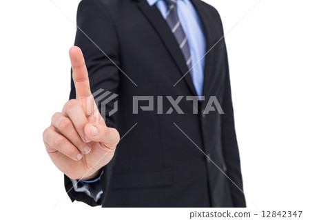 Mid section of businessman pointing something up 12842347