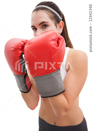 Fit brunette in boxing gloves 12842398
