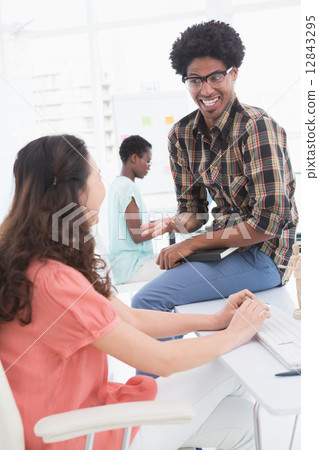 Young creative team working at desk Young creative team working at desk 12843295