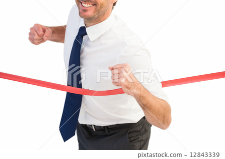Businessman smiling and crossing the line Businessman smiling and crossing the line 12843339