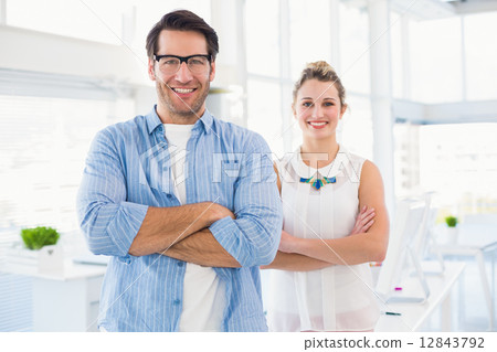 smilling photo editor posing with arms crossed 12843792