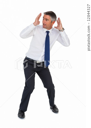 Businessman bending and with head between hands Businessman bending and with head between hands 12844327
