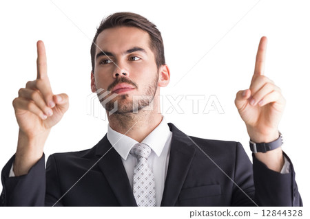 Concentrated businessman in suit measuring something 12844328