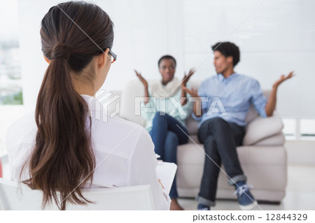 Couple talking with their therapist Couple talking with their therapist 12844329