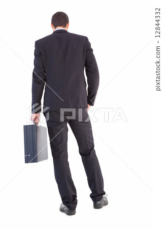 Rear view of businessman holding a briefcase Rear view of businessman holding a briefcase 12844332