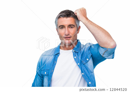 Doubtful man with his fist on head Doubtful man with his fist on head 12844520