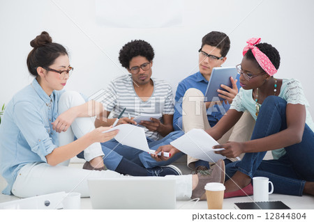 Young creative team brainstorming together Young creative team brainstorming together 12844804