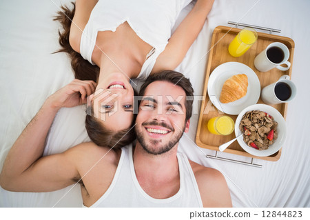 Young couple having breakfast in bed 12844823